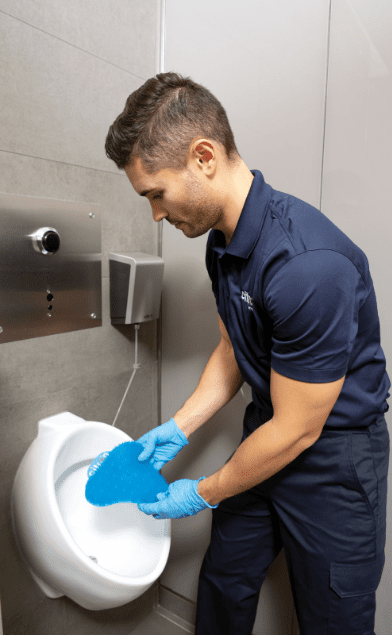 Technician replacing Urinal Anti Splash