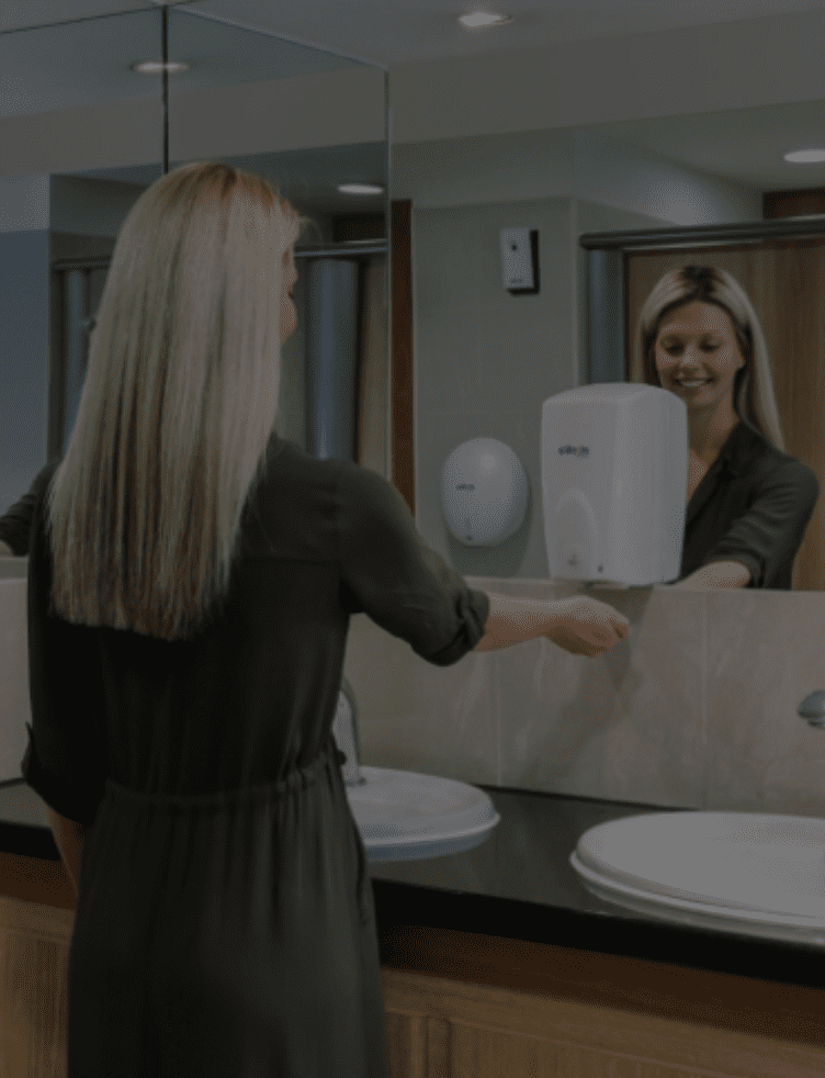 woman using a citron hygiene soap dispenser