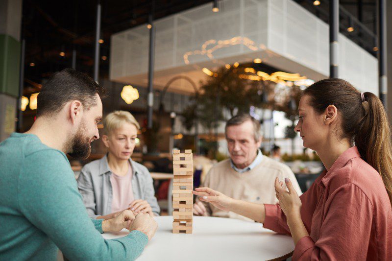 family playing games in restaurant