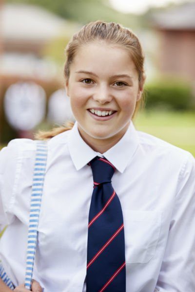 portrait of female teenage student in uniform