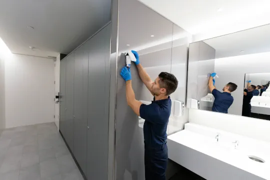 citron-hygiene-man-installing-commercial-air-care-in-a-washroom